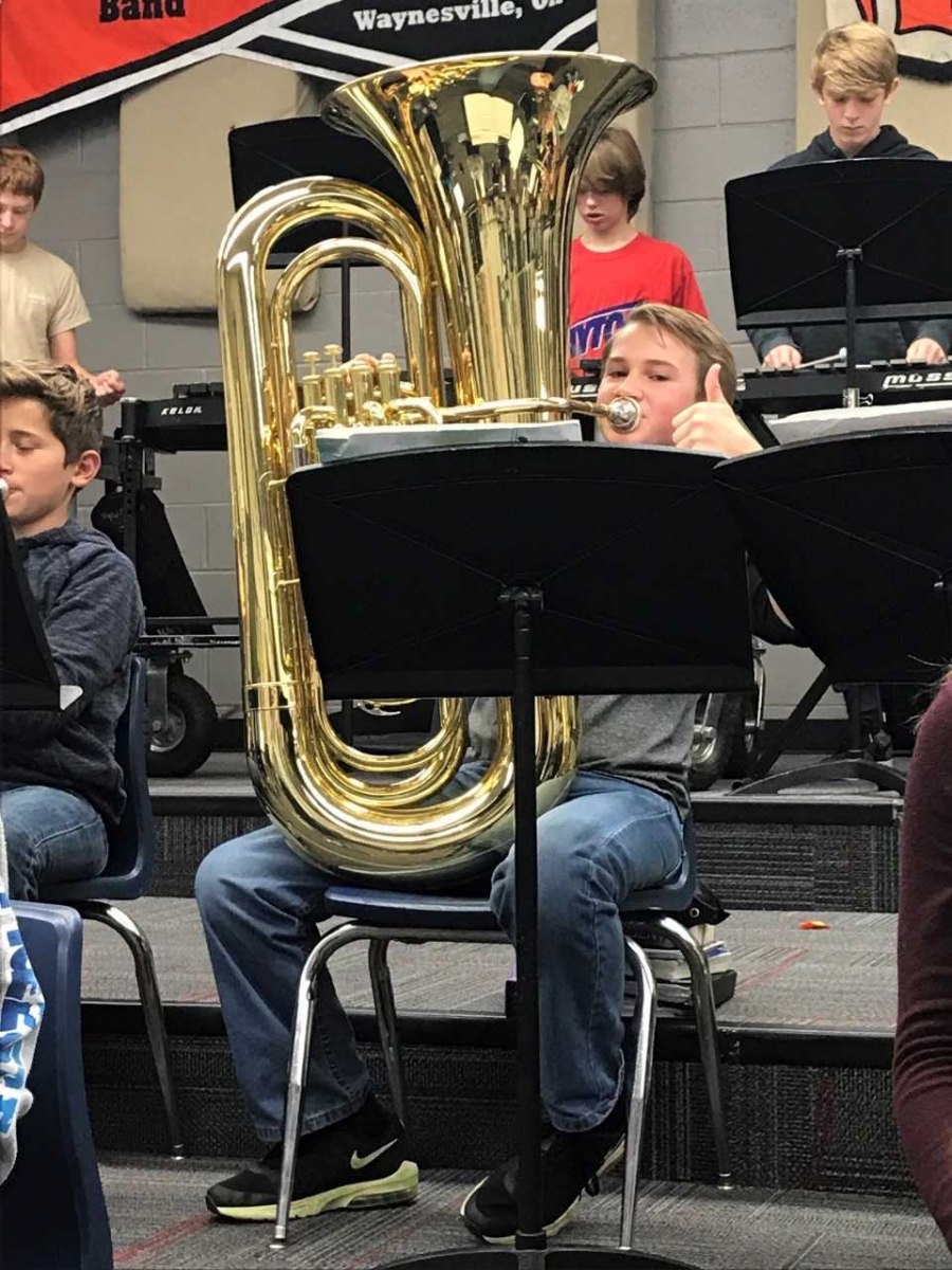 student playing an instrument